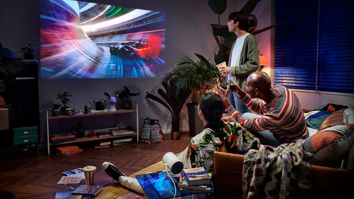 Friends come together to watch the Samsung Freestyle projector