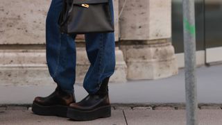 jeans tucked into platform boots