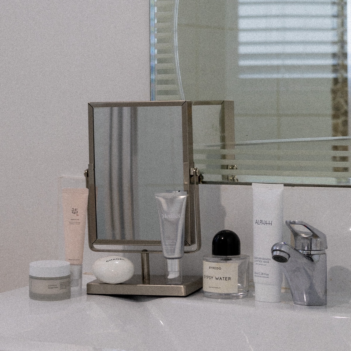 Beauty products on a bathroom sink