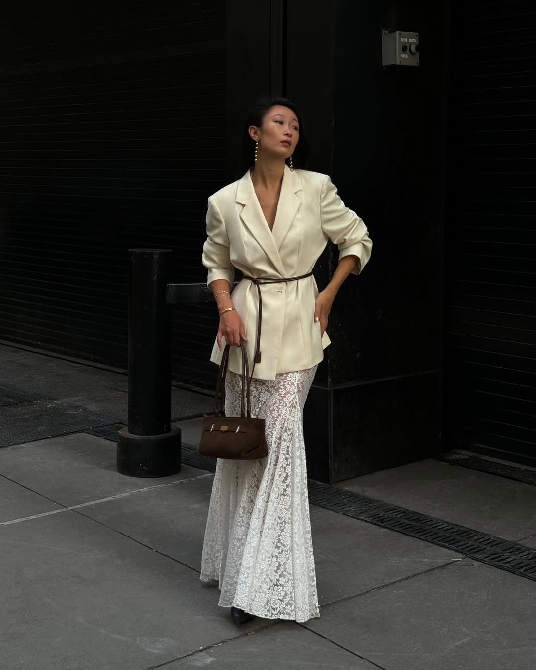 Caroline in a belted blazer