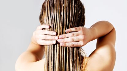 woman applying conditioner