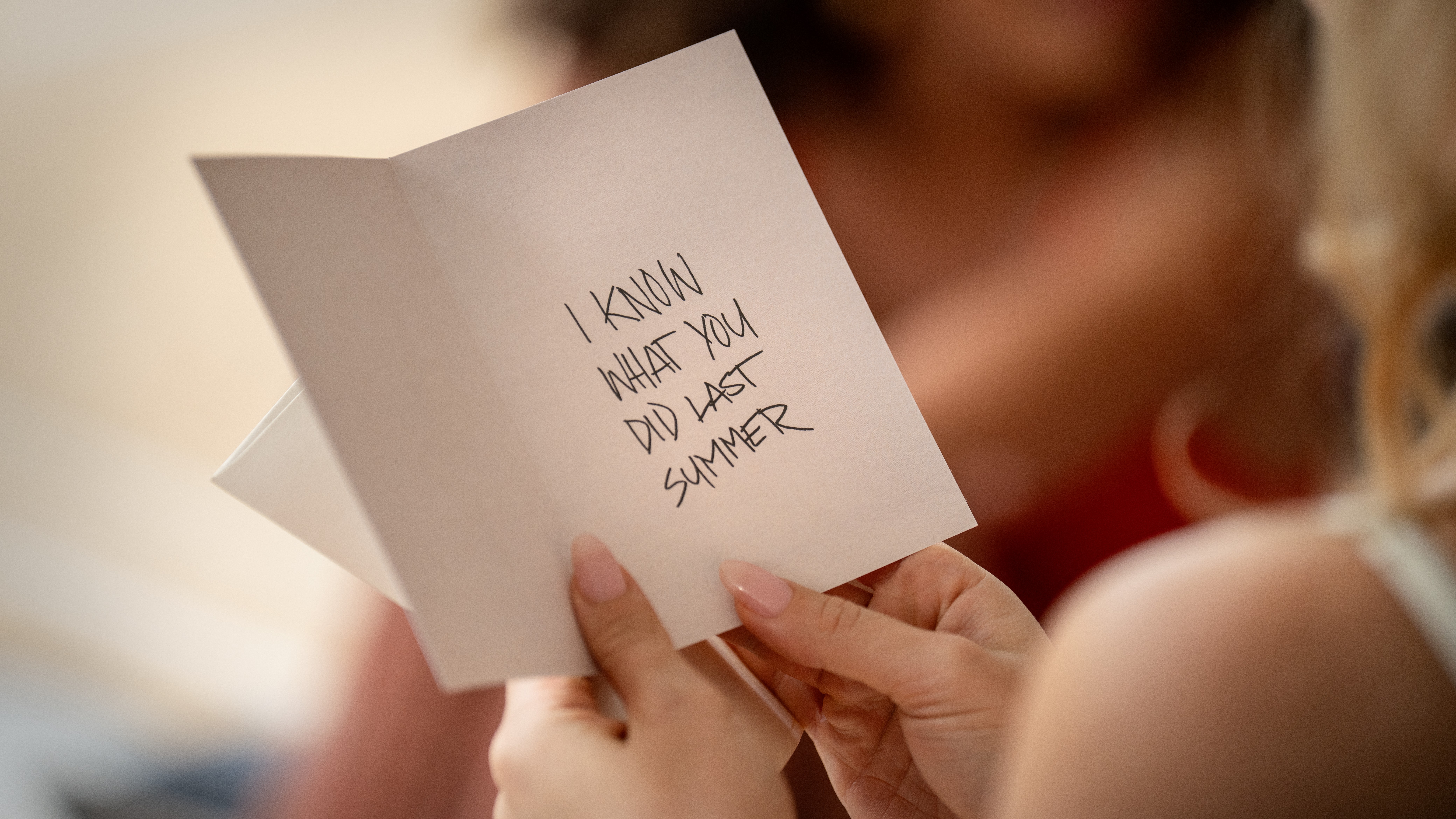 A close-up of a card with &quot;I Know What You Did Last Summer&quot; written inside in a promo still for &quot;I Know What You Did Last Summer&quot; (2025)