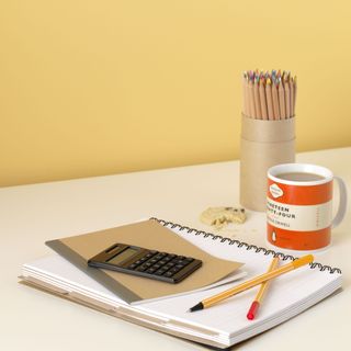 table with mug and calculator