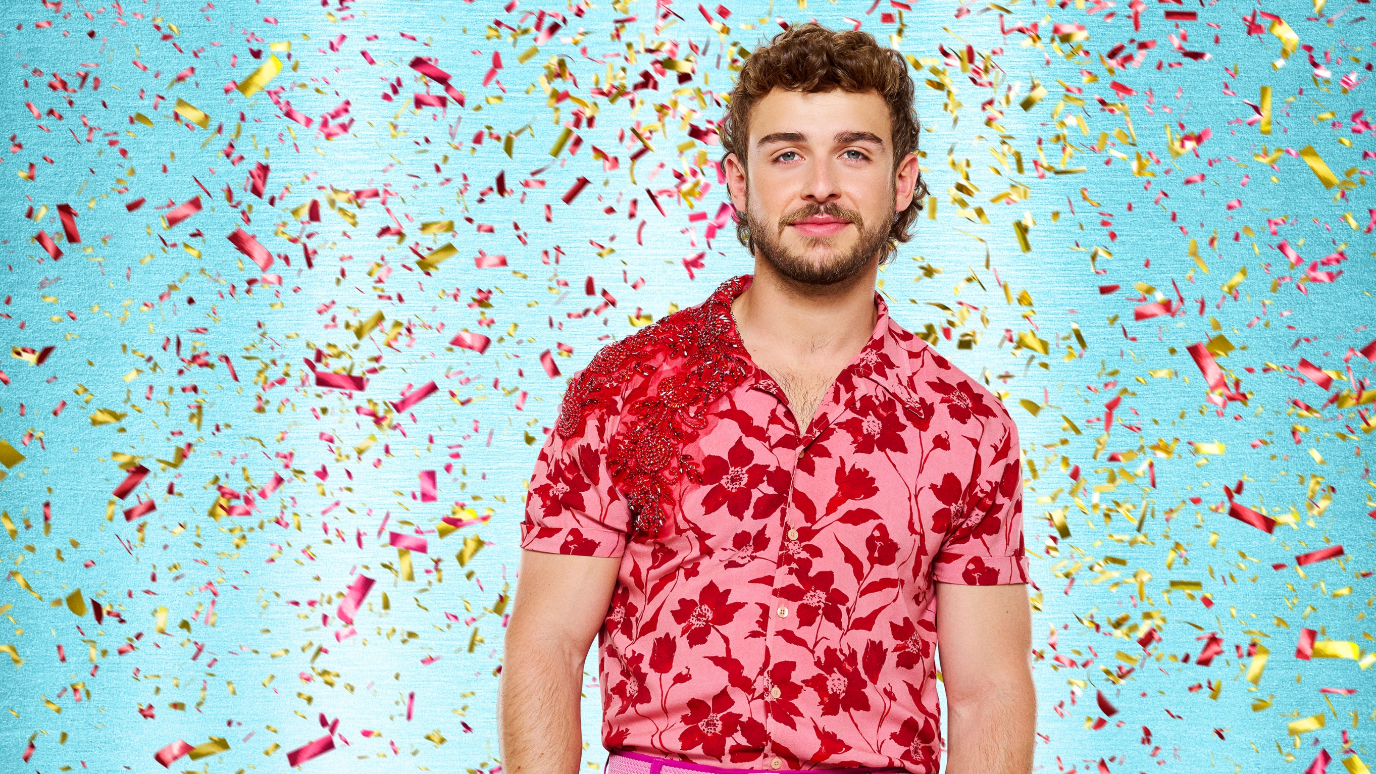 Strictly Come Dancing 2025 - George Clarke in a red flowery shirt with confetti falling around him.