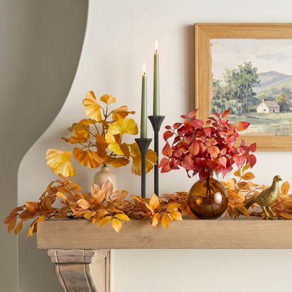 Faux fall foliage stems on a mantle