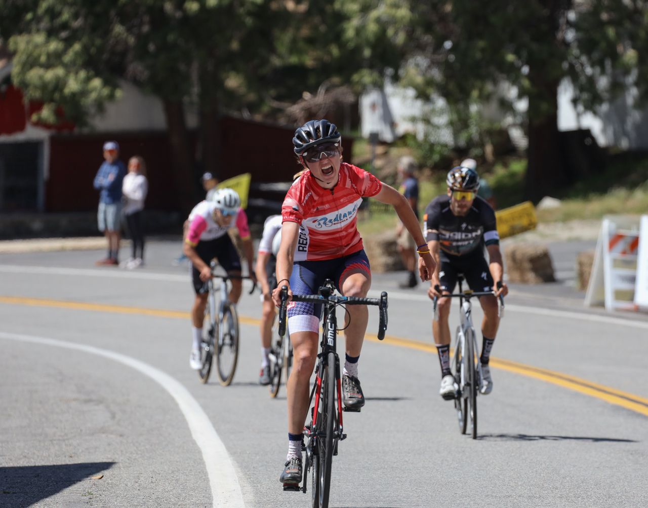 Emily Marcolini (3T/Q+M) wins stage 2 for women with men's field closing behind