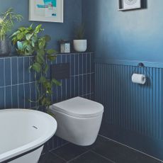 Blue bathroom with panelling and tiles