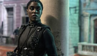 No Time To Die Lashana Lynch hiding behind a column