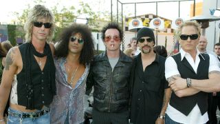 Velvet Revolver posing on a red carpet in 2003