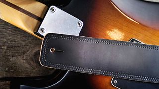 A leather guitar strap on a Fender Stratocaster 