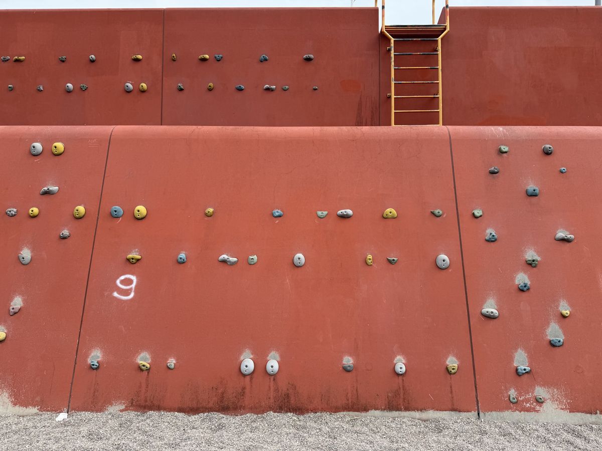 Sample photo from iPhone 17 Pro showing orange climbing wall outdoors