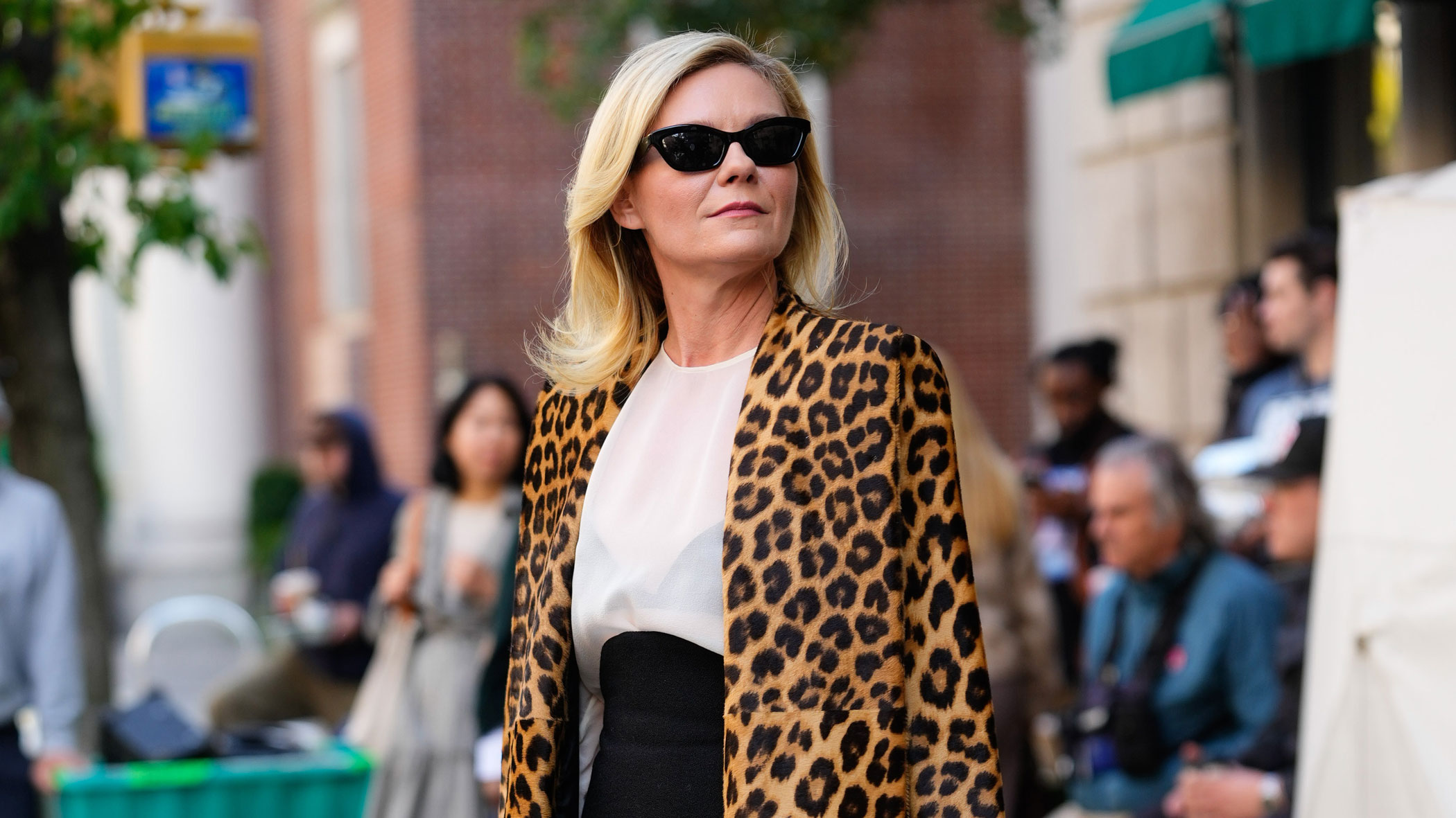 Kirsten Dunst on the set of The Housemaid's Secret wearing a leopard coat