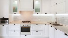 White kitchen with lighted cabinets