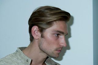 Photo of male model facing sideways