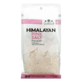 A white and pink bag of Himalayan salt