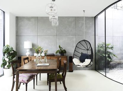 A dining room with a swing and more seating