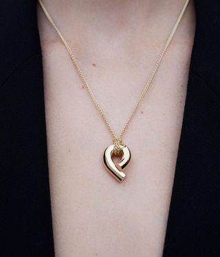 Gold necklace by Tabayer.