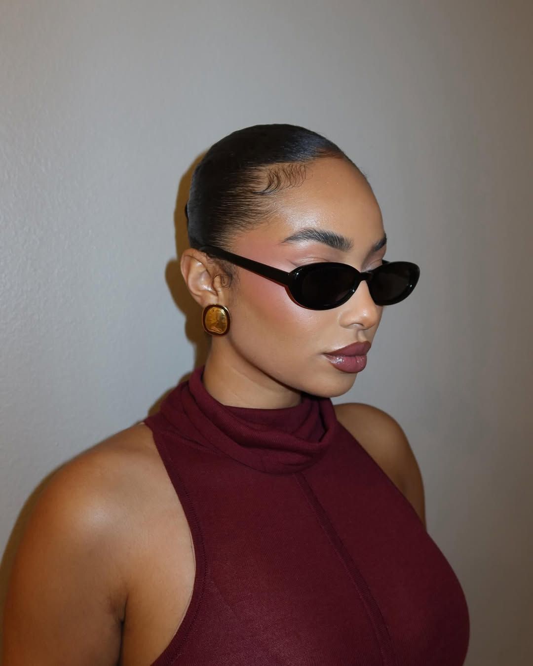 Symphani Soto wears a chic slick-back bun