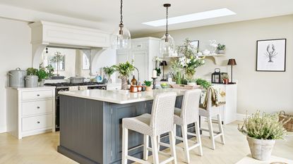 White kitchen with navy stools