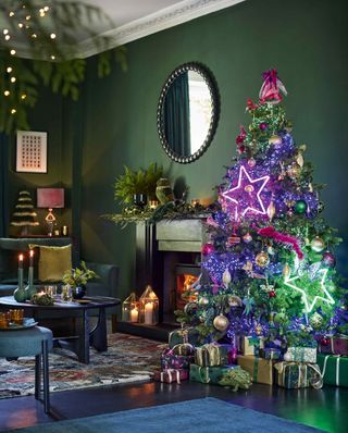 green Christmas living room with neon star lights on the Christmas tree