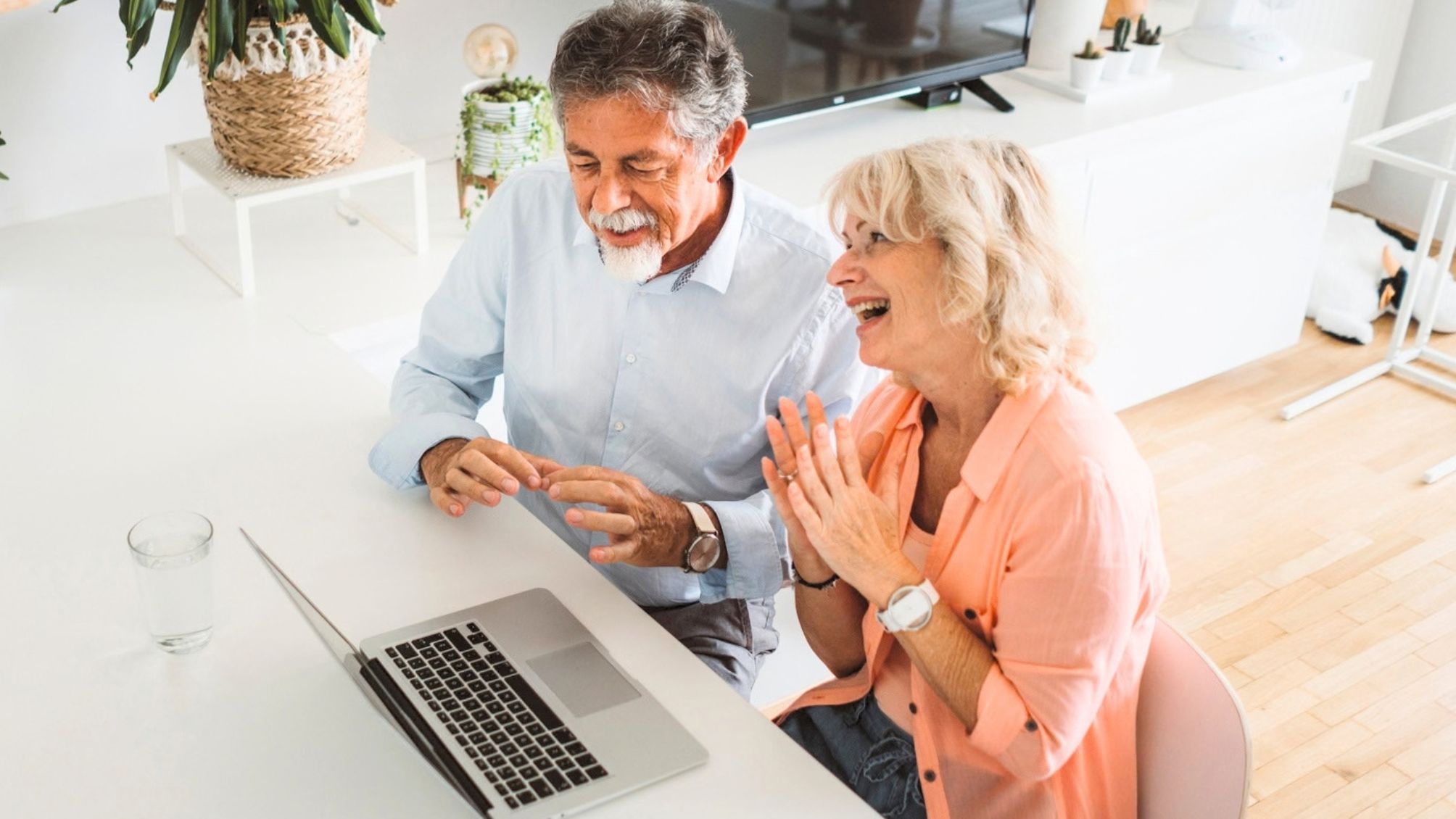 A couple having a lively conversation on a video call. 