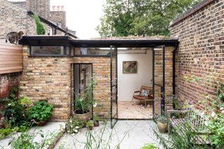 brick garden room with glazed patio doors