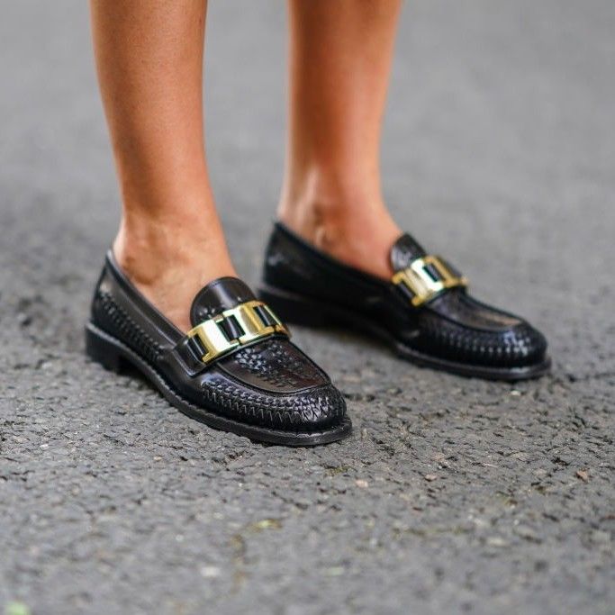 Estelle Chemouny wears black leather Prada shoes