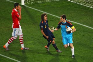 Carles Puyol celebrates with Iker Casillas after his penalty save in Spain's 2010 World Cup quarter-final against Paraguay.