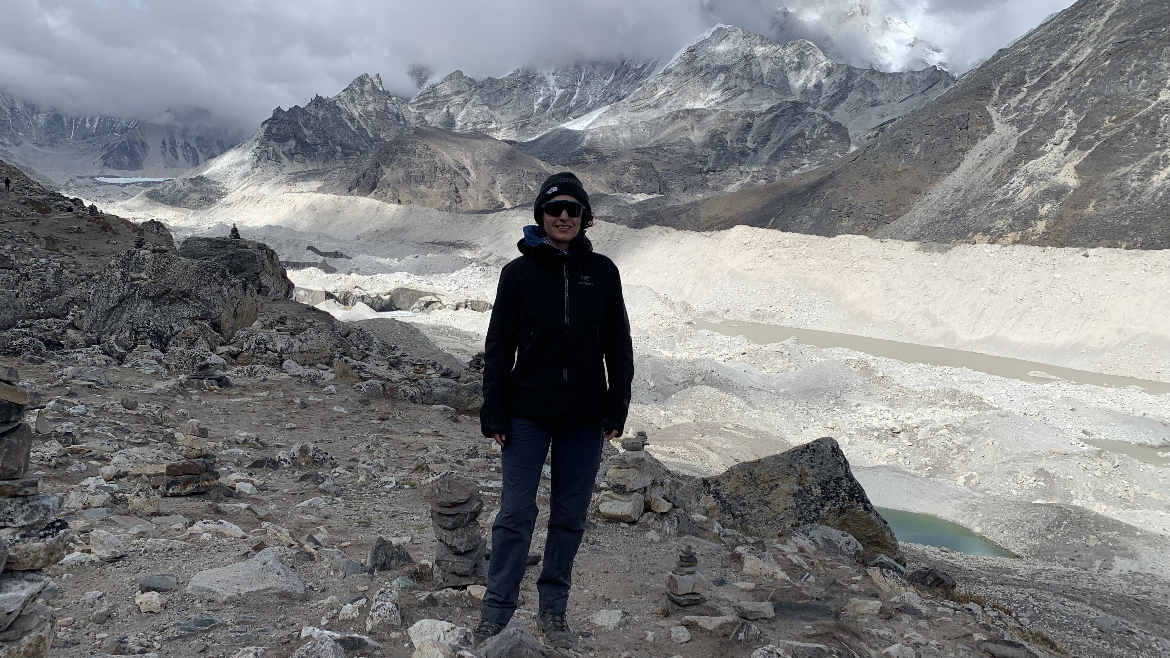 Julia Clarke standing in front of the Khumbu Glacier wearing the Arc&#039;teryx Beta AR Stormhood