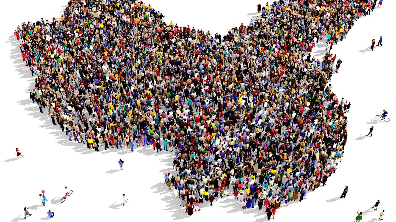 A crowd of people forming the outline of China&amp;#039;s borders on a white background