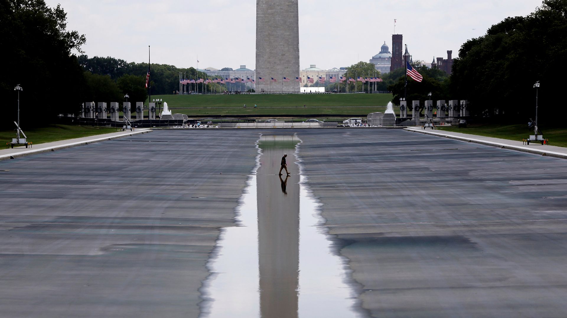 
                                The Washington Monument is seen reflected in the drained Lincoln Memorial Reflecting Pool, in Washington, D.C.
                            