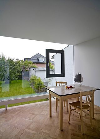 Dining area with glass view of Loïc Picquet