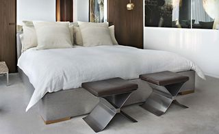 The bedroom carries over their archetypal palette of neutrals at Yabu Pushelberg's home in NYC