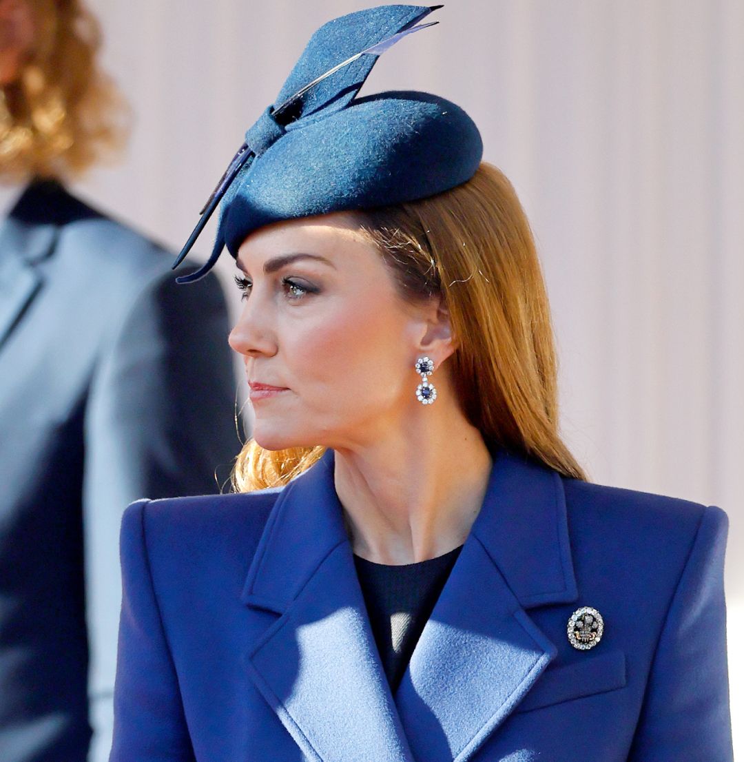 Kate Middleton wearing a blue coat and hat