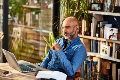 Man sitting watching laptop