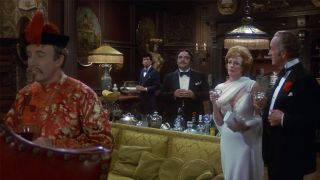 The cast of Murder by Death dressed up for dinner in a scene from the movie. 