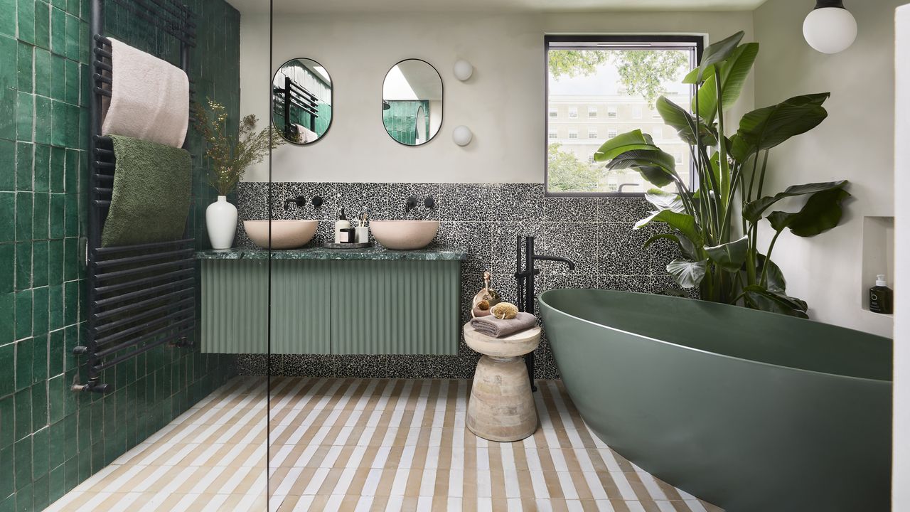 Ca&#039;Pietra green bathroom with beige and white striped tiles