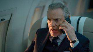 The Tailor (Tcheky Karyo) on the phone in his jet in Boat Story episode 1