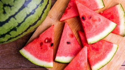 how to pick a watermelon - Watermelon slices on a wooden board 