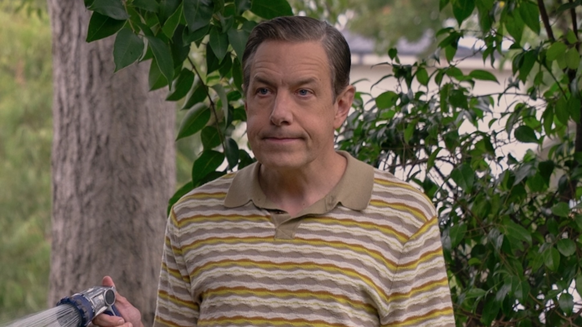 Kripke watering his yard. 