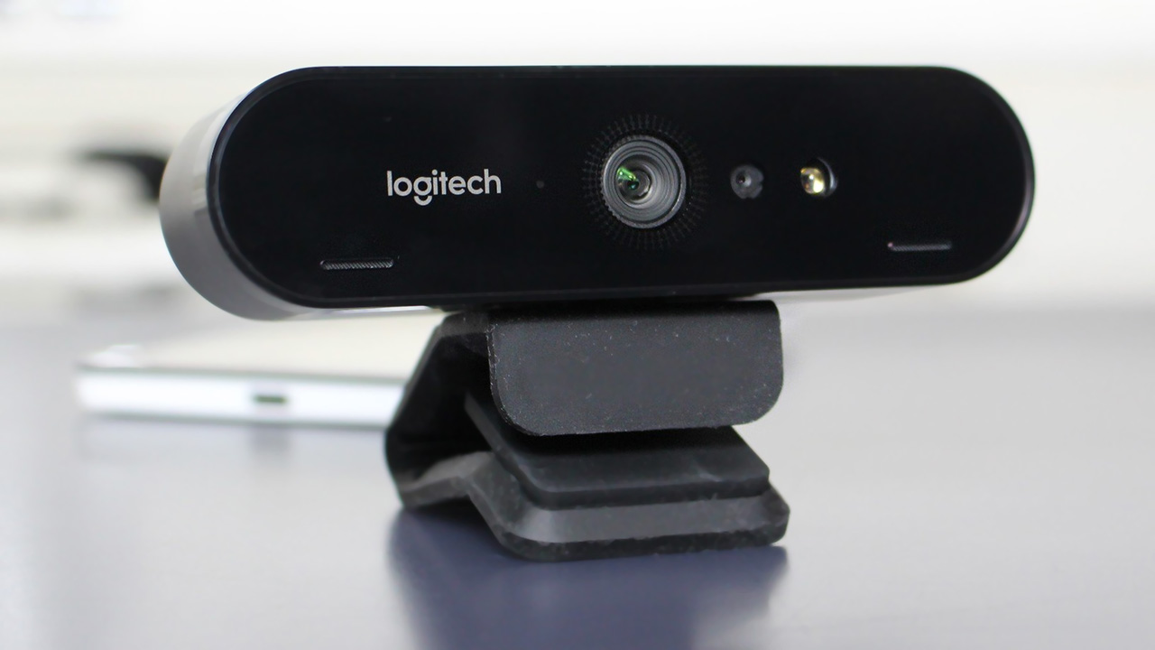 Logitech BRIO 4K webcam on a desk with mount folded