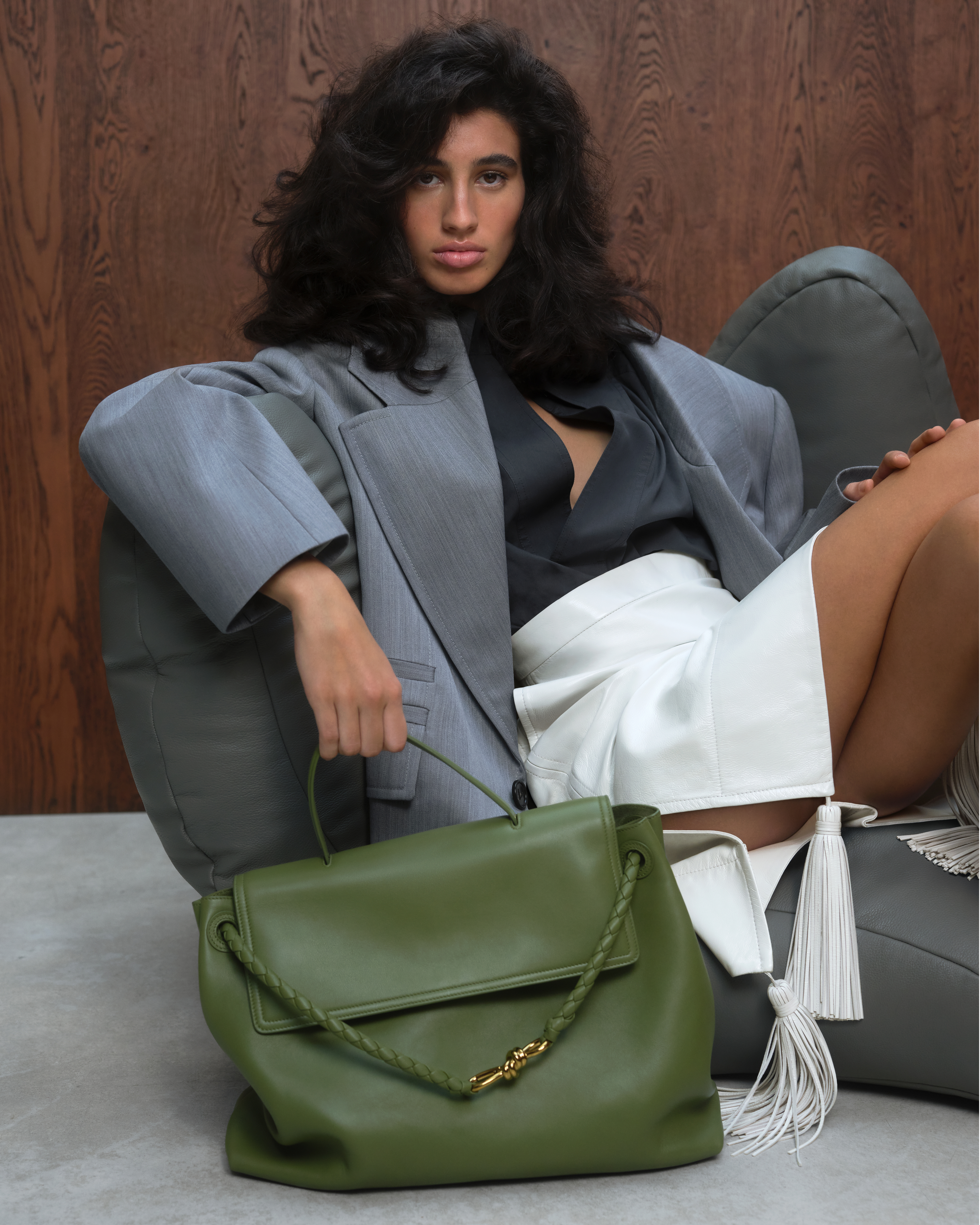 model with the Bottega Veneta ciao ciao bag in green