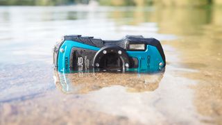 Pentax WG-90 half-submerged in a lake