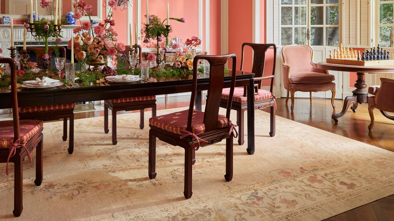 A modern traditional dining room showcasing the Ruggable x Bridgerton area rug