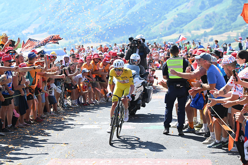 LE LIORAN, FRANCE - JULY 14: Tadej Pogacar of Slovenia and UAE Team Emirates - XRG - Yellow Leader Jersey competes in the breakaway while fans cheers during the 113th Tour de France 2026, Stage 10 a 166.6km stage from Aurillac to Le Lioran 1240m / #UCIWT / on July 14, 2026 in Le Lioran, France. (Photo by Dario Belingheri/Getty Images)