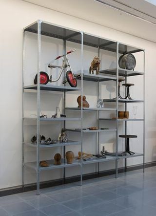 Various items displayed on shelving unit
