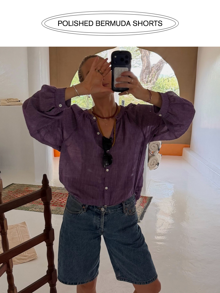 Influencer wearing denim bermuda shorts