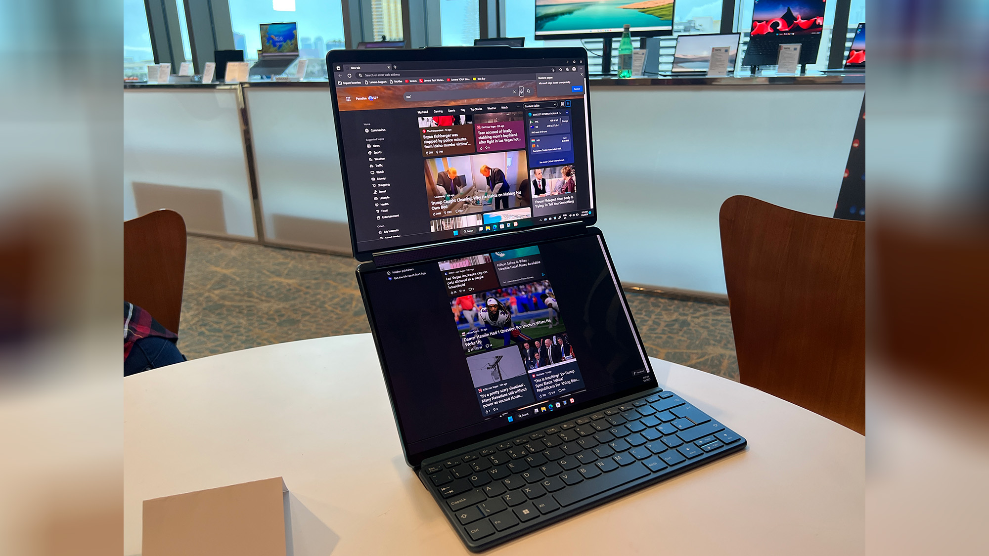 A Lenovo Yoga Book 9i on a table in Waterfall mode
