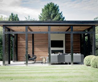 Freestanding pergola with outdoor living space beneath and outdoor tv on wall