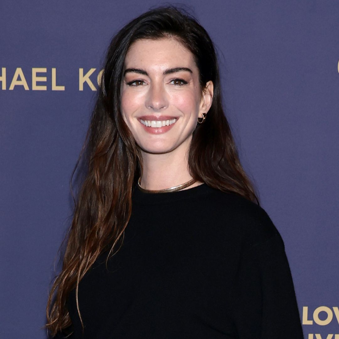Anne Hathaway arrived at the 2025 Golden Heart Awards wearing all-black Michael Kors, plus the skirt over pants trend